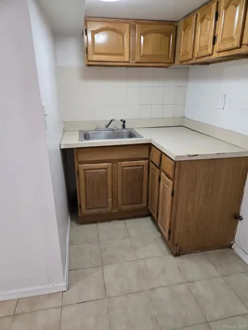 a kitchen with stainless steel appliances a sink and cabinets