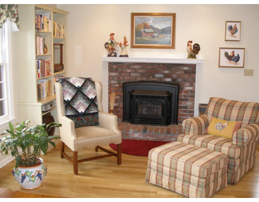 38 Bay Colony Drive Ashland, MA 01721 - Photo 7 of 18 a living room with furniture and a fireplace