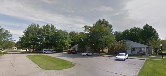 a view of a park with sitting area