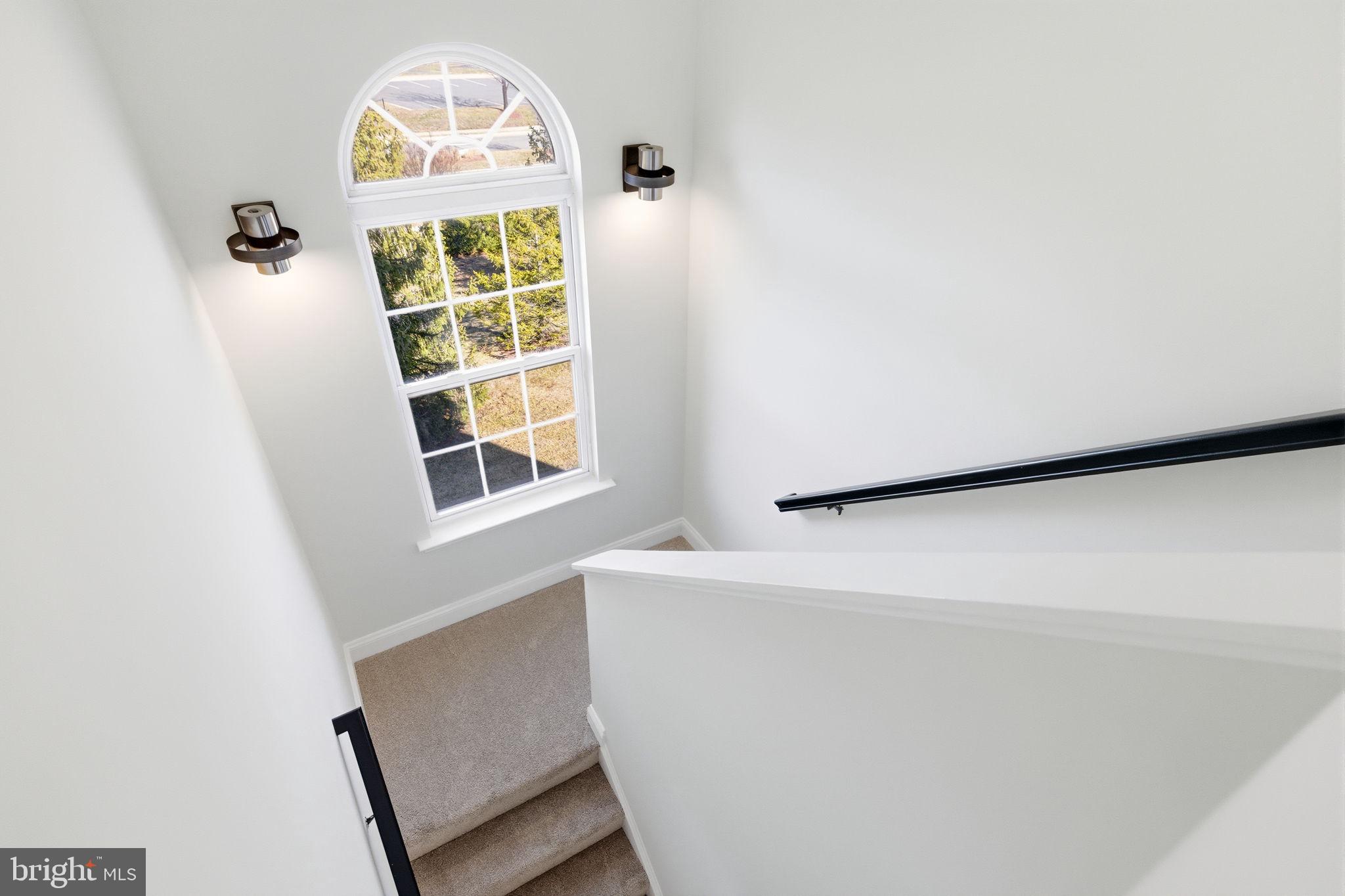 601 Springhouse Square Southeast Leesburg, VA 20175 - Photo 41 of 90 Two story stair way from upper and middle level