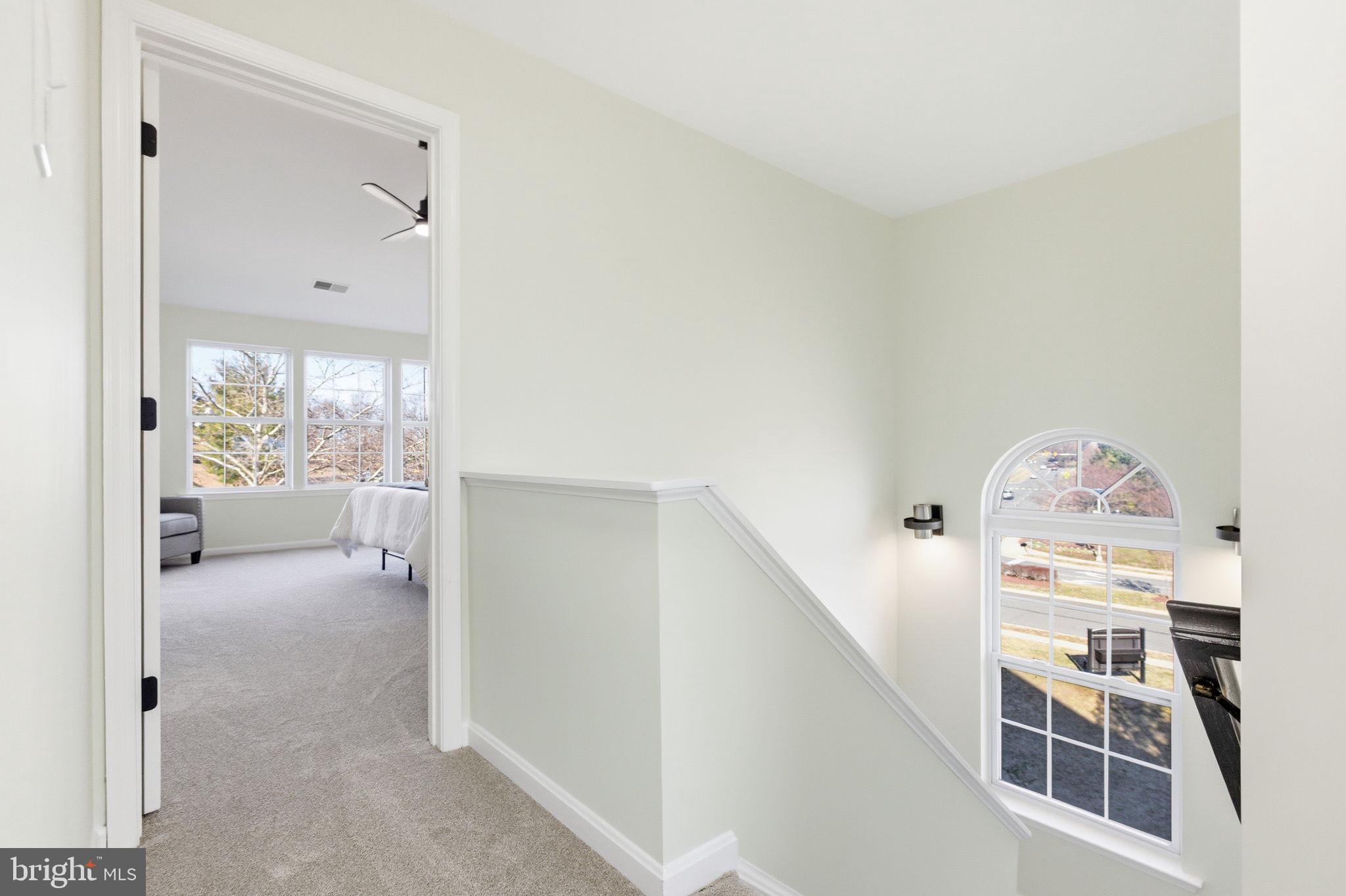 601 Springhouse Square Southeast Leesburg, VA 20175 - Photo 42 of 90 Upper hallway stairwell toward primary suite