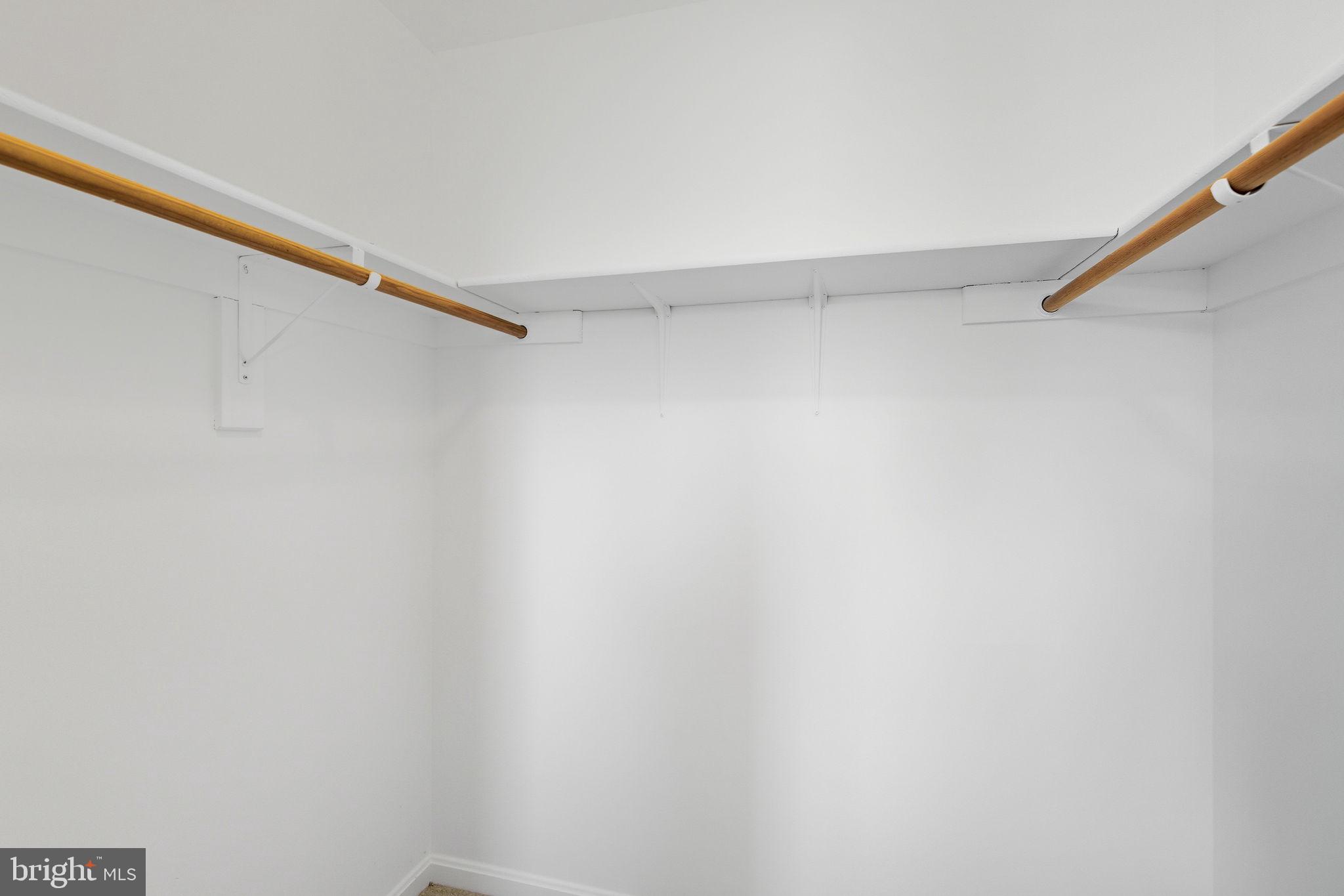 601 Springhouse Square Southeast Leesburg, VA 20175 - Photo 63 of 90 Front left bedroom Walk-in closet