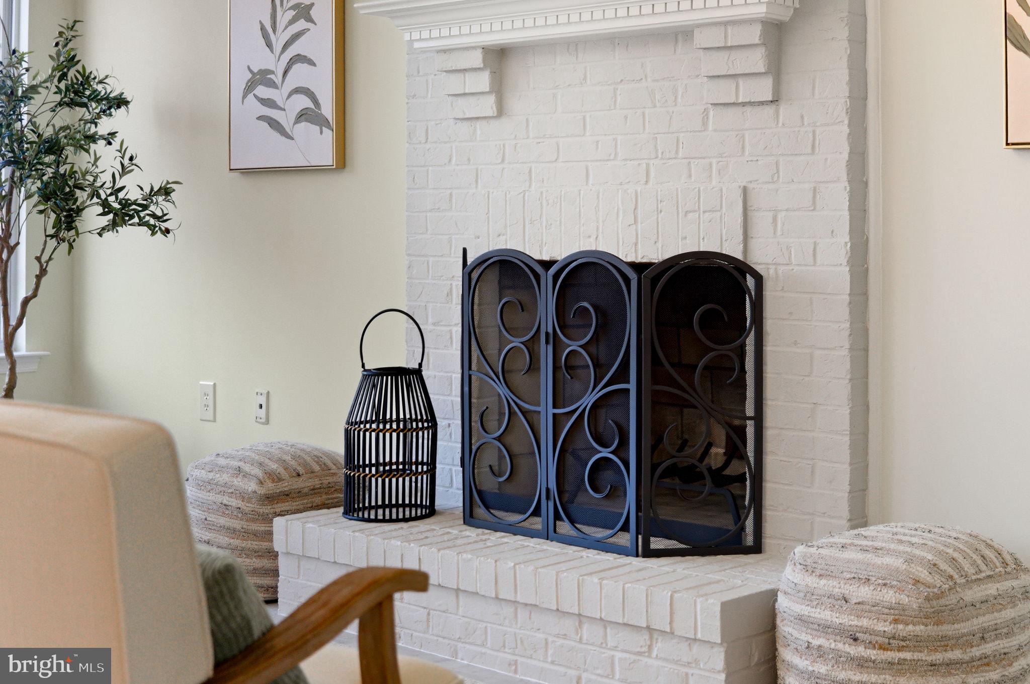 601 Springhouse Square Southeast Leesburg, VA 20175 - Photo 7 of 90 Wood burning fireplace in 2nd main level seating