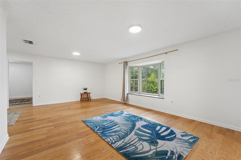 2007 Golf View Drive Dunedin, FL 34698 - Photo 12 of 39 a view of a room with wooden floor and window