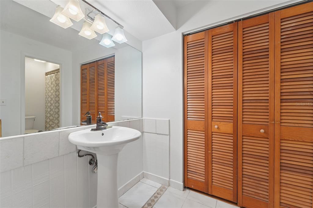 2007 Golf View Drive Dunedin, FL 34698 - Photo 15 of 39 a bathroom with a sink a mirror and a shower