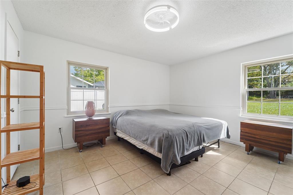 2007 Golf View Drive Dunedin, FL 34698 - Photo 18 of 39 a bedroom with a bed and a window