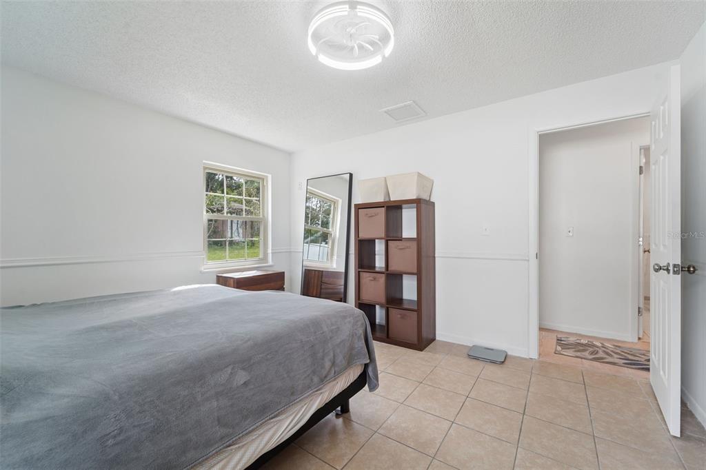 2007 Golf View Drive Dunedin, FL 34698 - Photo 19 of 39 a bedroom with a bed and a window