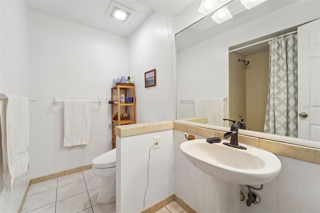 2007 Golf View Drive Dunedin, FL 34698 - Photo 20 of 39 a bathroom with a sink a toilet and shower