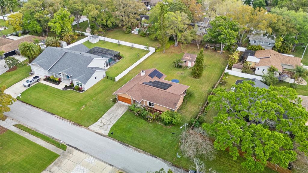 2007 Golf View Drive Dunedin, FL 34698 - Photo 35 of 39 an aerial view of a house with a garden and lake view