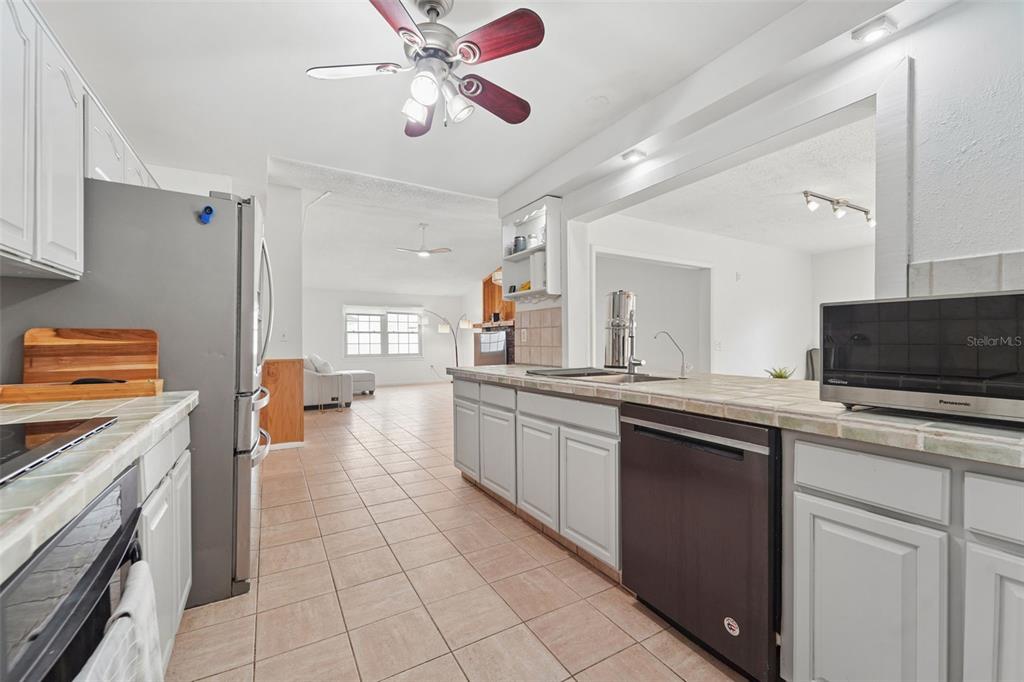 2007 Golf View Drive Dunedin, FL 34698 - Photo 8 of 39 a kitchen with a sink and a stove top oven