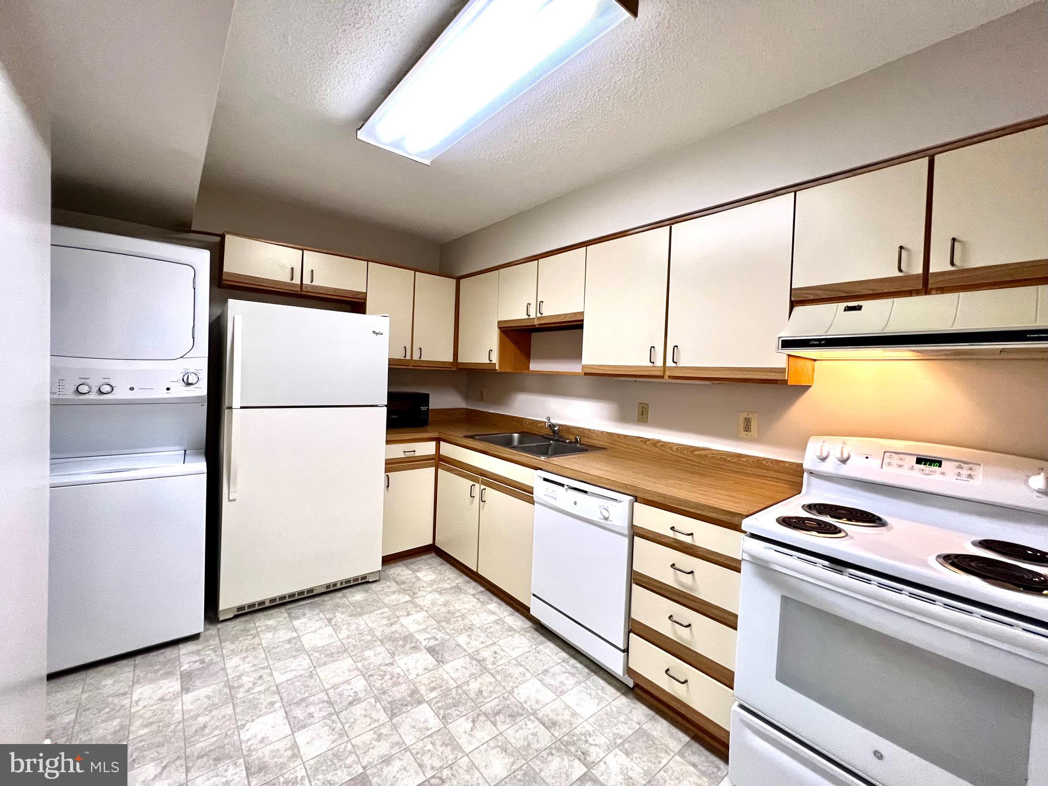 15115 Interlachen Drive, Unit 701 Silver Spring, MD 20906 - Photo 14 of 48 Table space kitchen with washer/dryer