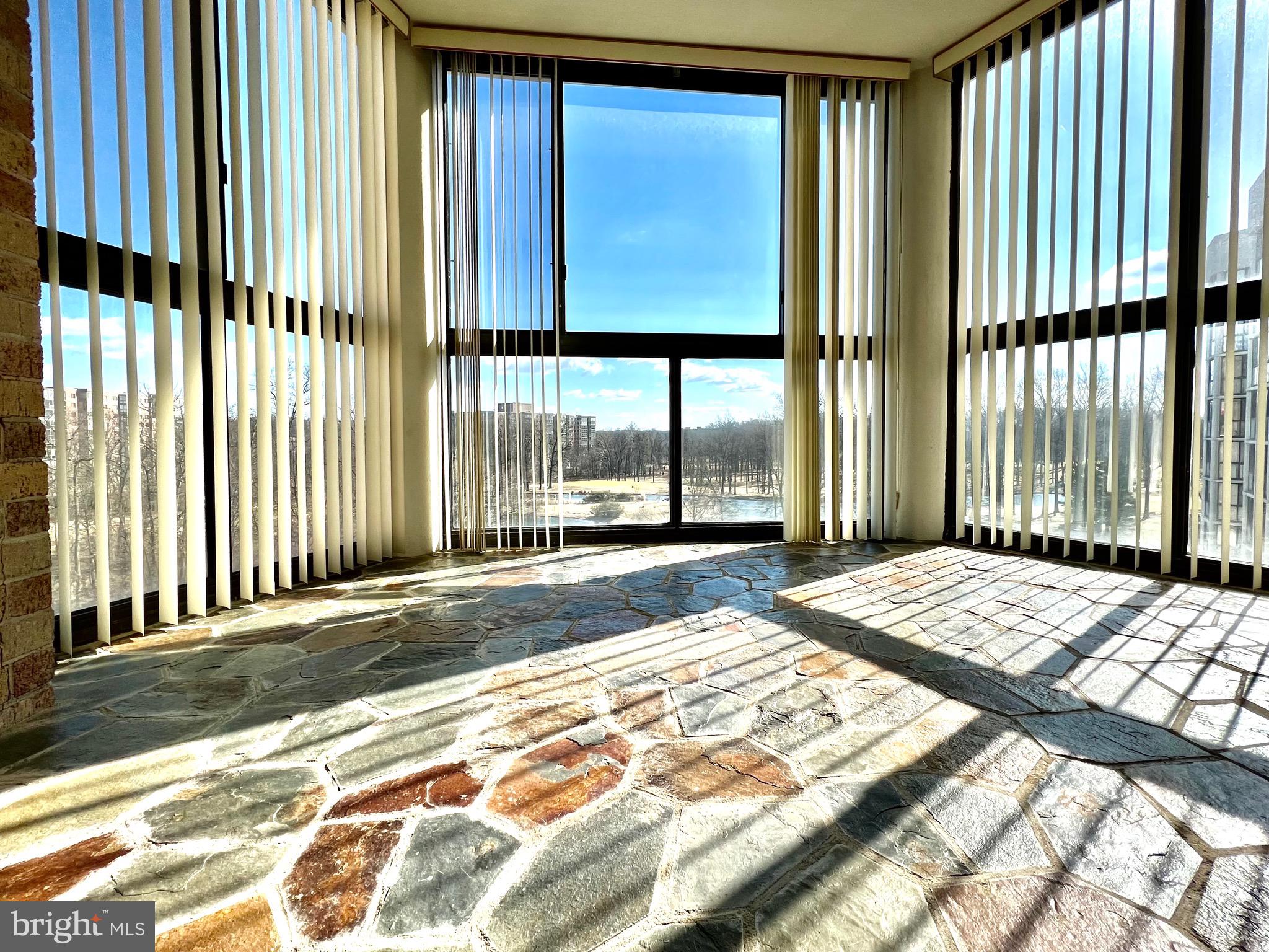 15115 Interlachen Drive, Unit 701 Silver Spring, MD 20906 - Photo 18 of 48 Sunroom with slate floor