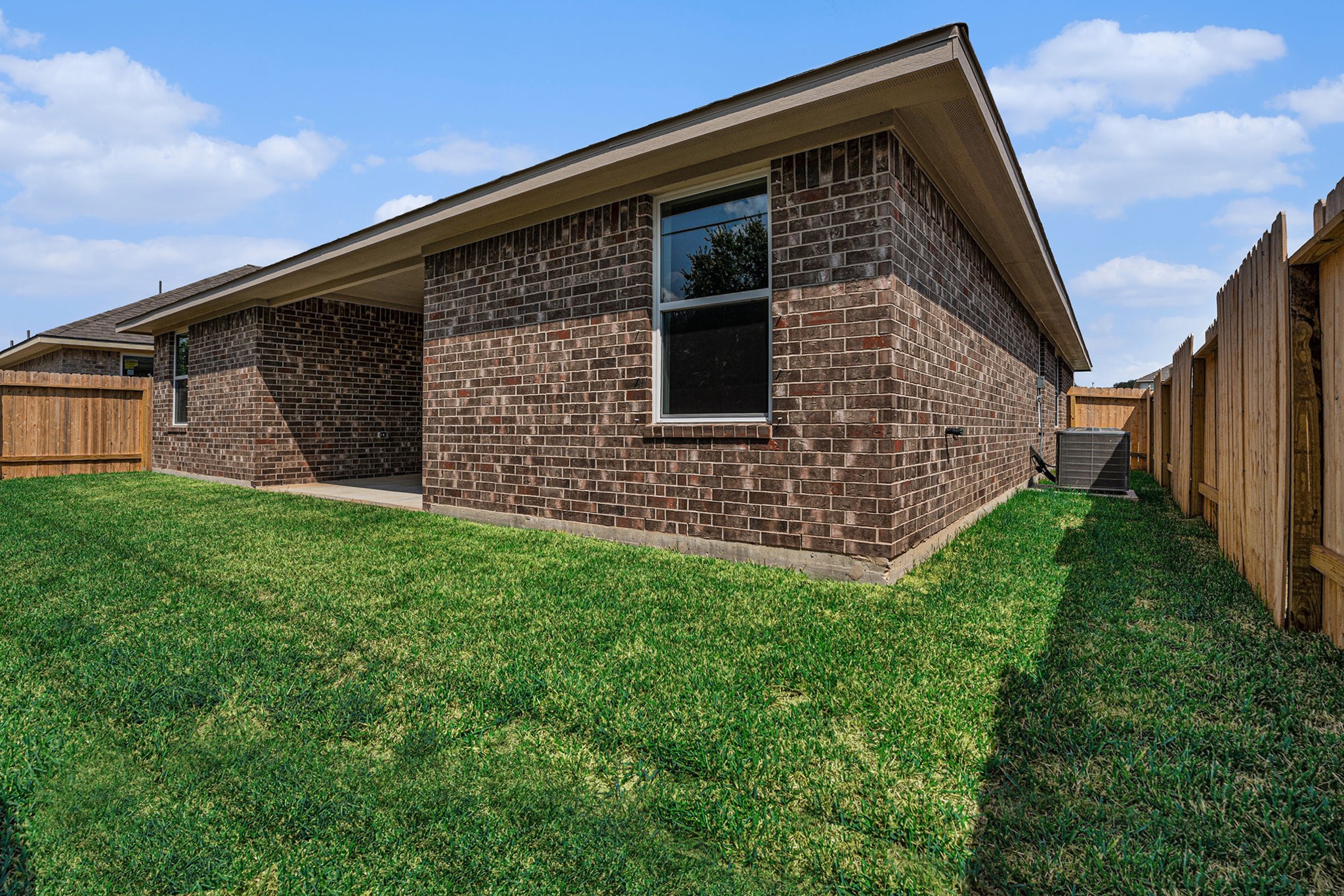 33 Greenbriar Loop Angleton, TX 77515 - Photo 17 of 18 a front view of house with a garden