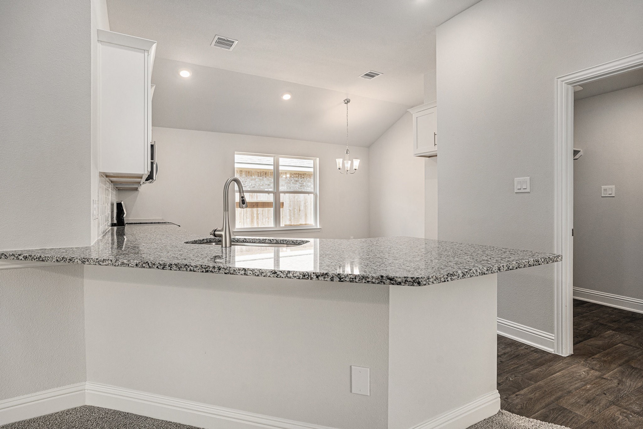 33 Greenbriar Loop Angleton, TX 77515 - Photo 6 of 18 a bathroom with a granite countertop sink and a mirror