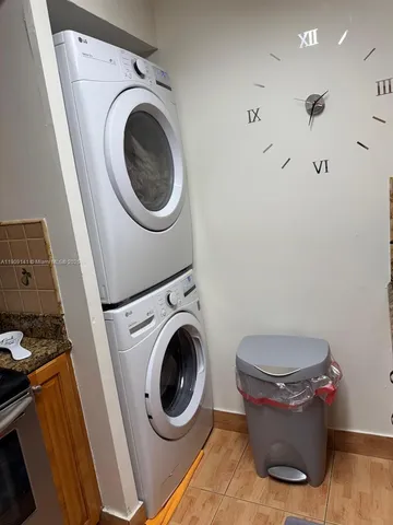 a bed sitting in a room next to a window