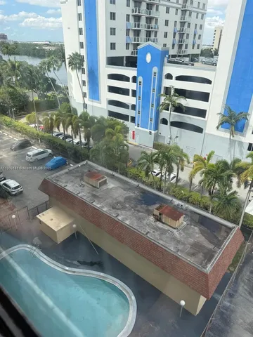 a view of a swimming pool with a lounge chairs