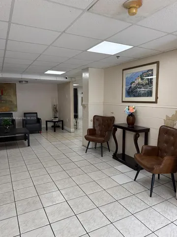 a view of a workspace with furniture