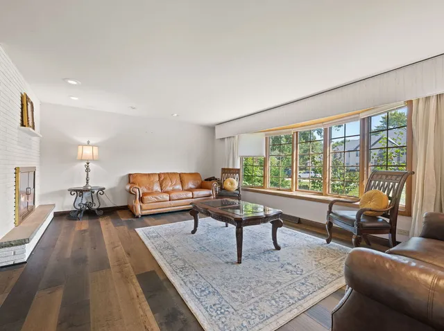 a living room with furniture and a rug