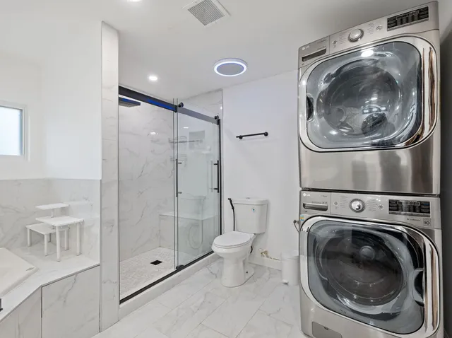 a utility room with dryer and washer