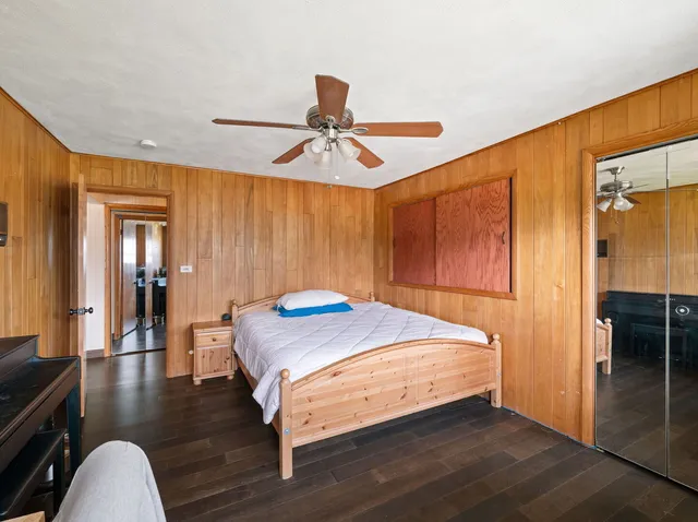 a bed room with a bed and a chandelier