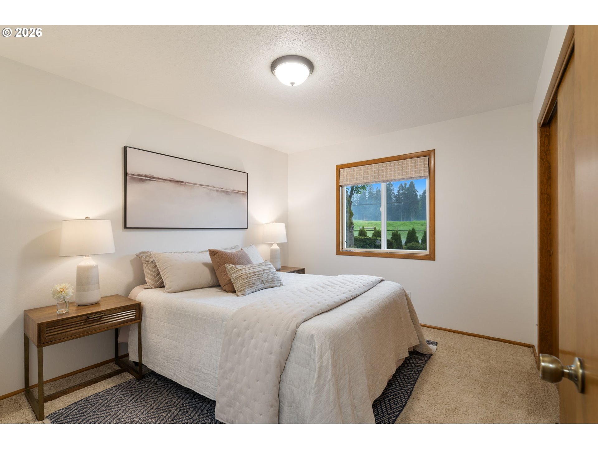 24950 Airport Road Northeast Aurora, OR 97002 - Photo 18 of 44 a bedroom with a bed and a night stand