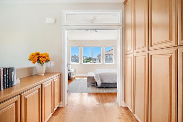 a hallway with table and flowerpot