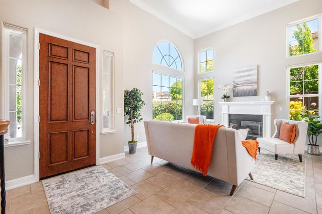 a living room with furniture and a rug