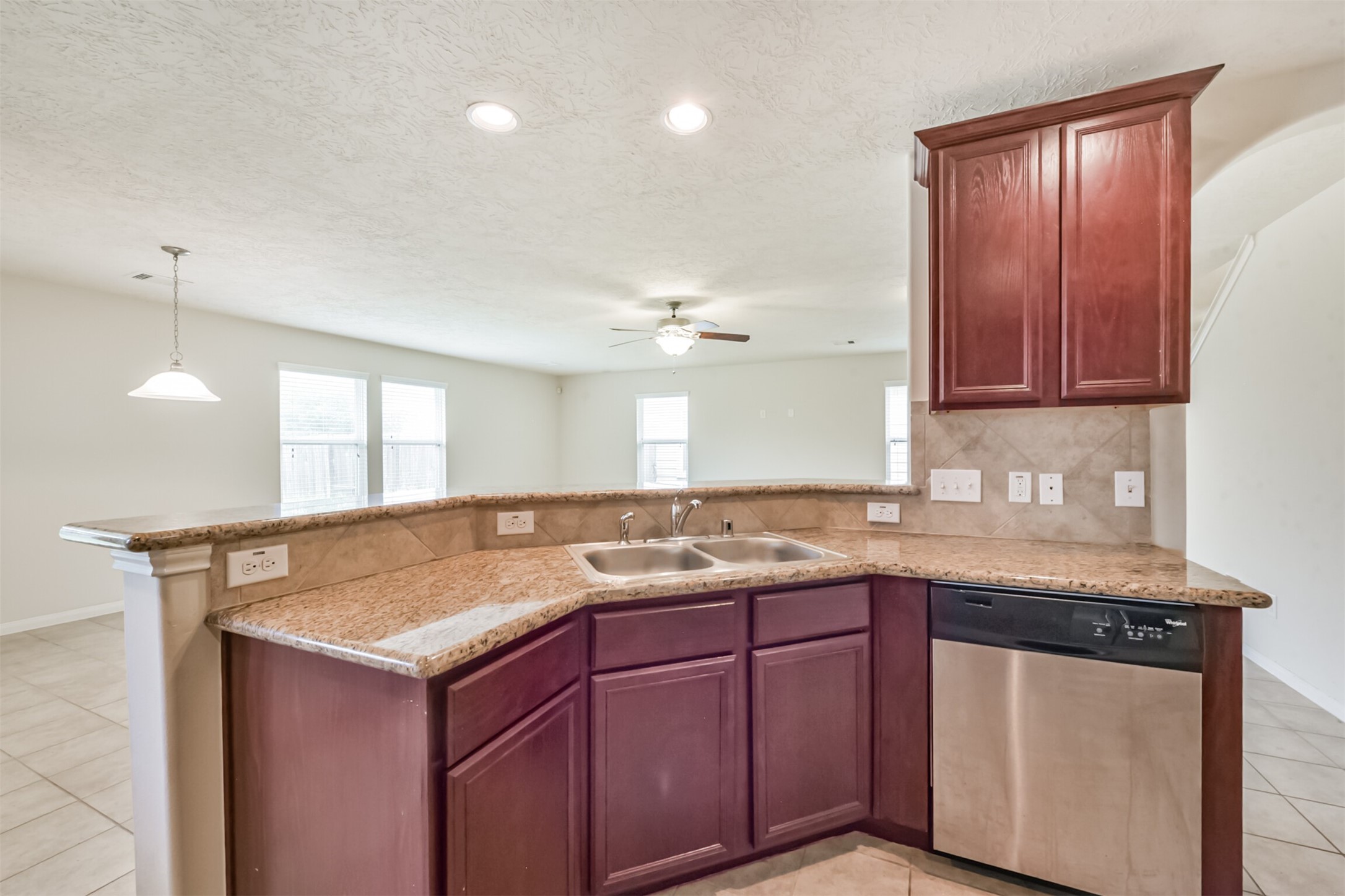 2142 Tandy Park Way Houston, TX 77047 - Photo 13 of 35 a kitchen with a sink and cabinets