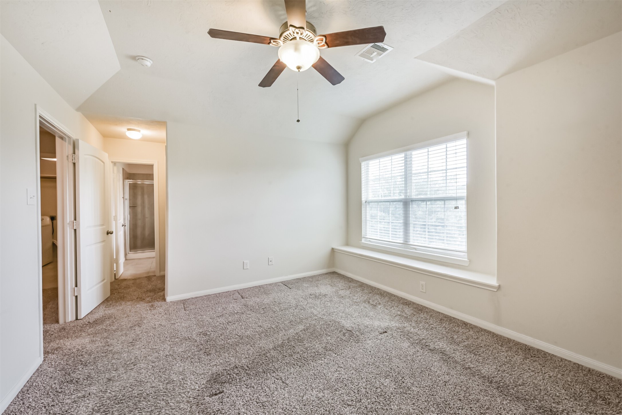 2142 Tandy Park Way Houston, TX 77047 - Photo 17 of 35 an empty room with chandelier fan and windows