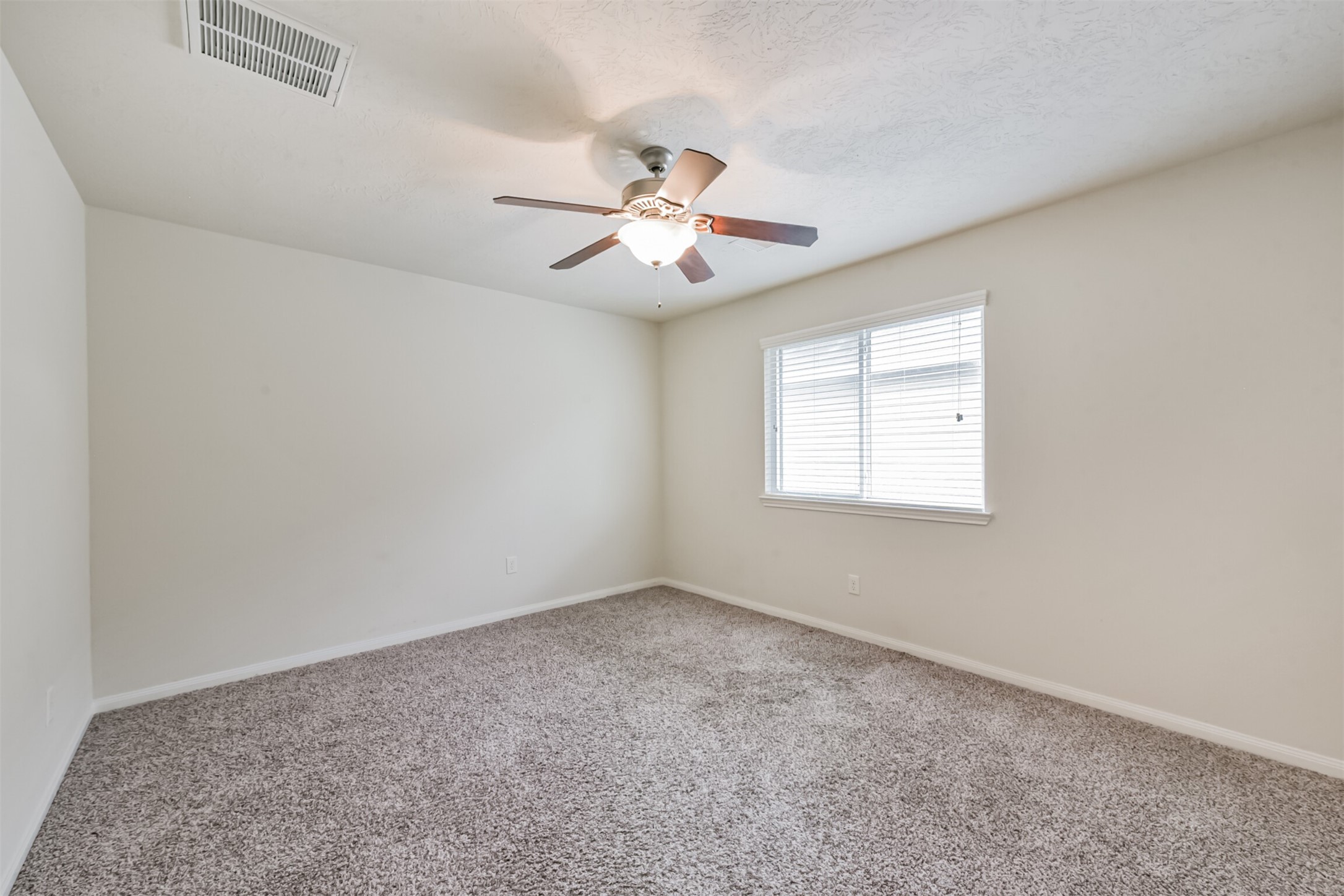 2142 Tandy Park Way Houston, TX 77047 - Photo 25 of 35 wooden floor in an empty room with a window