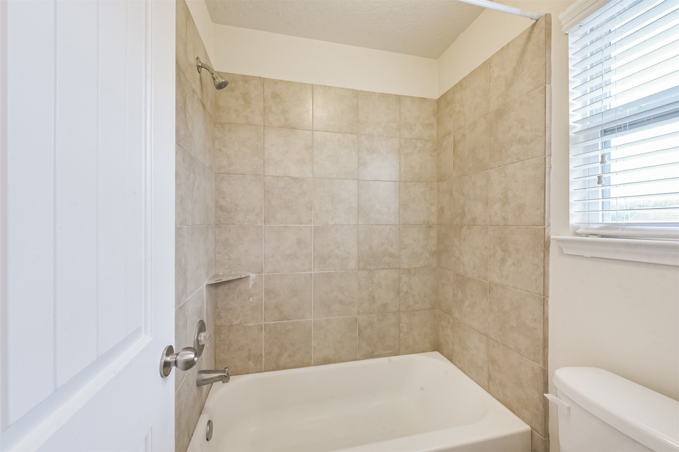 2142 Tandy Park Way Houston, TX 77047 - Photo 27 of 35 a bathroom with a shower and a toilet