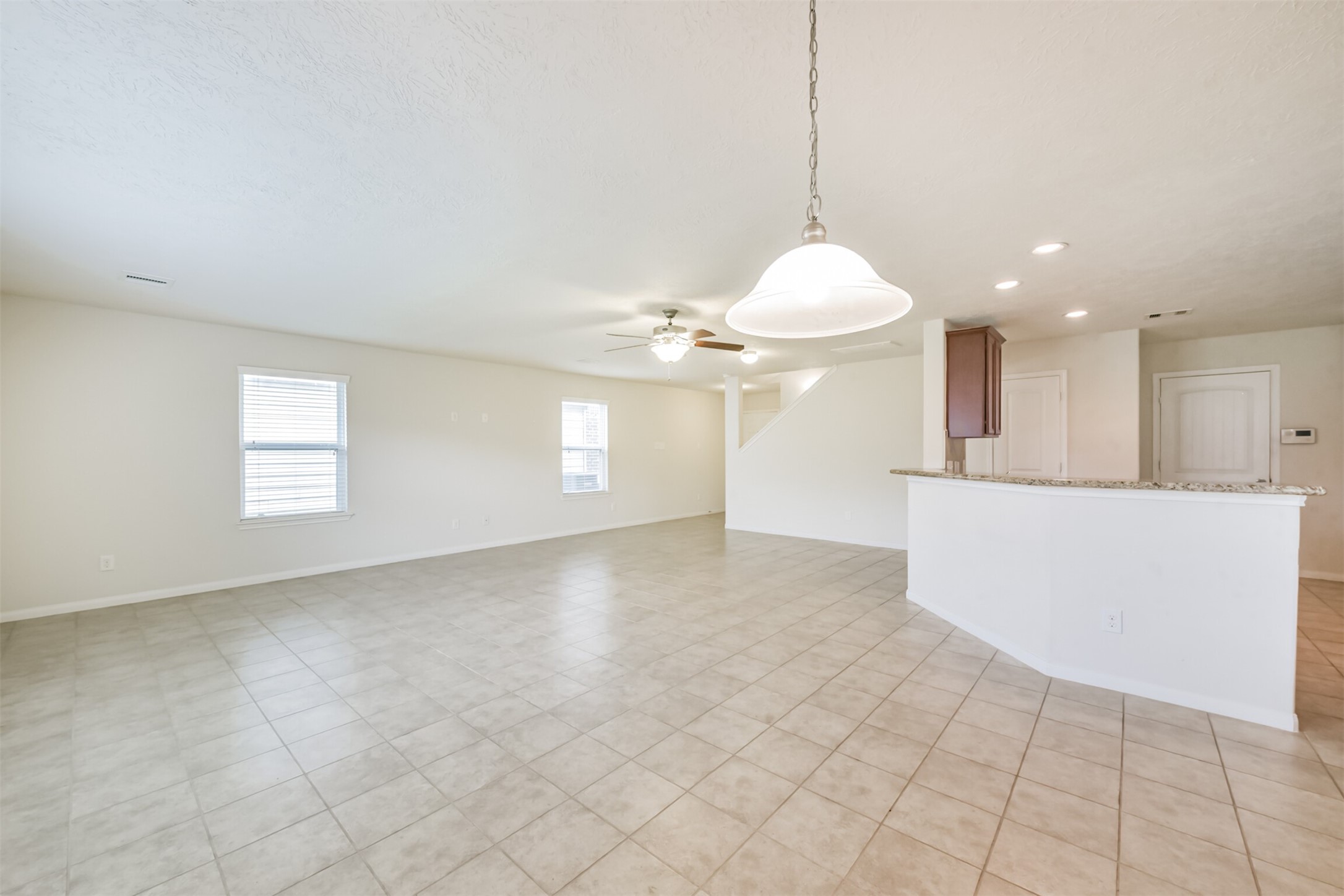2142 Tandy Park Way Houston, TX 77047 - Photo 7 of 35 a view of a kitchen with a sink and chandelier