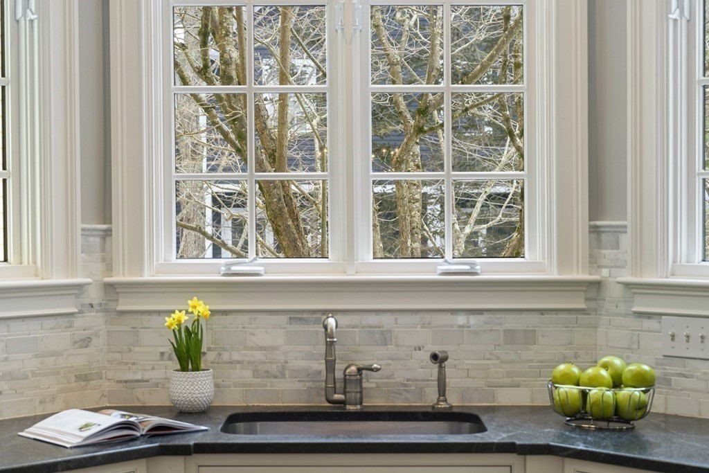 61 Garfield Road Concord, MA 01742 - Photo 11 of 33 a kitchen with a sink and window
