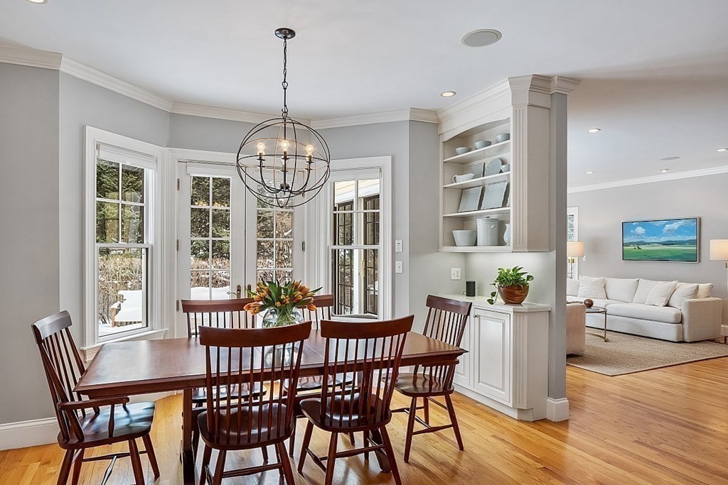 61 Garfield Road Concord, MA 01742 - Photo 13 of 33 a view of a dining room with furniture window and wooden floor