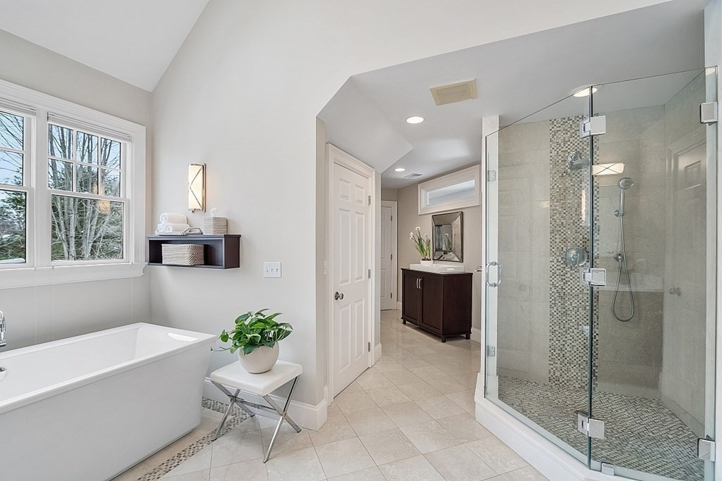 61 Garfield Road Concord, MA 01742 - Photo 20 of 33 a bathroom with a tub shower and window