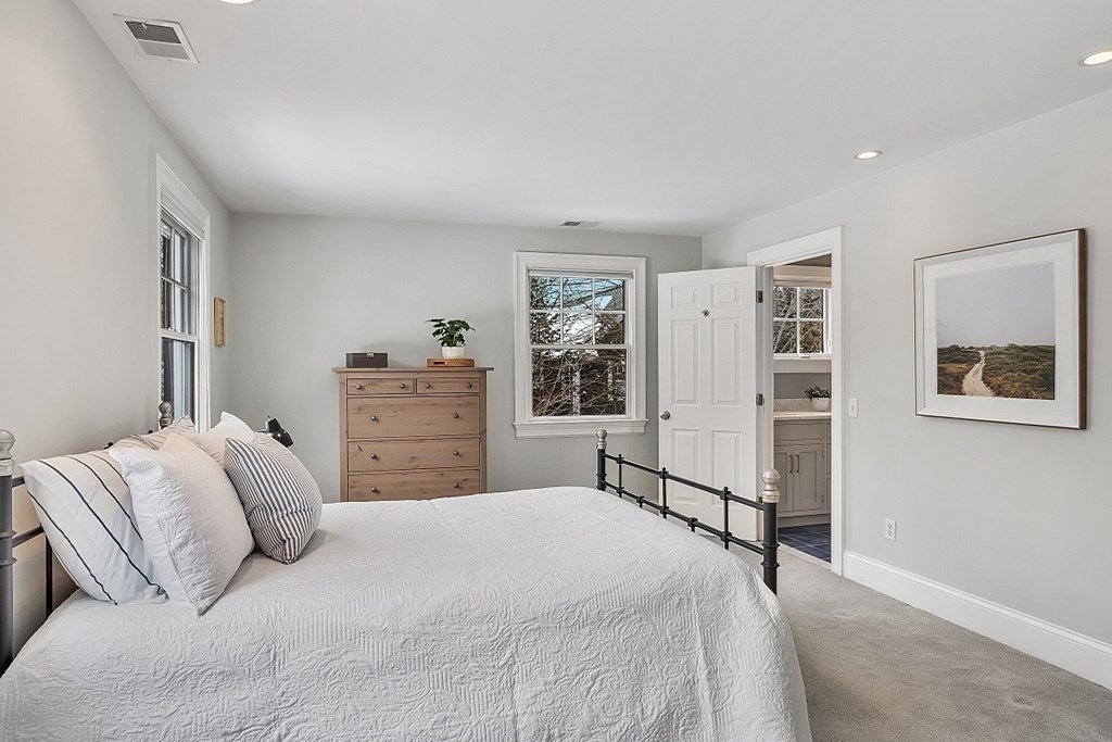 61 Garfield Road Concord, MA 01742 - Photo 22 of 33 a bedroom with a large bed and a window