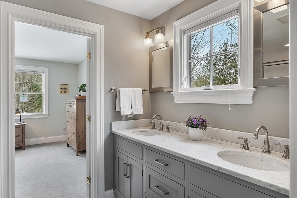 61 Garfield Road Concord, MA 01742 - Photo 23 of 33 a bathroom with sink and mirror