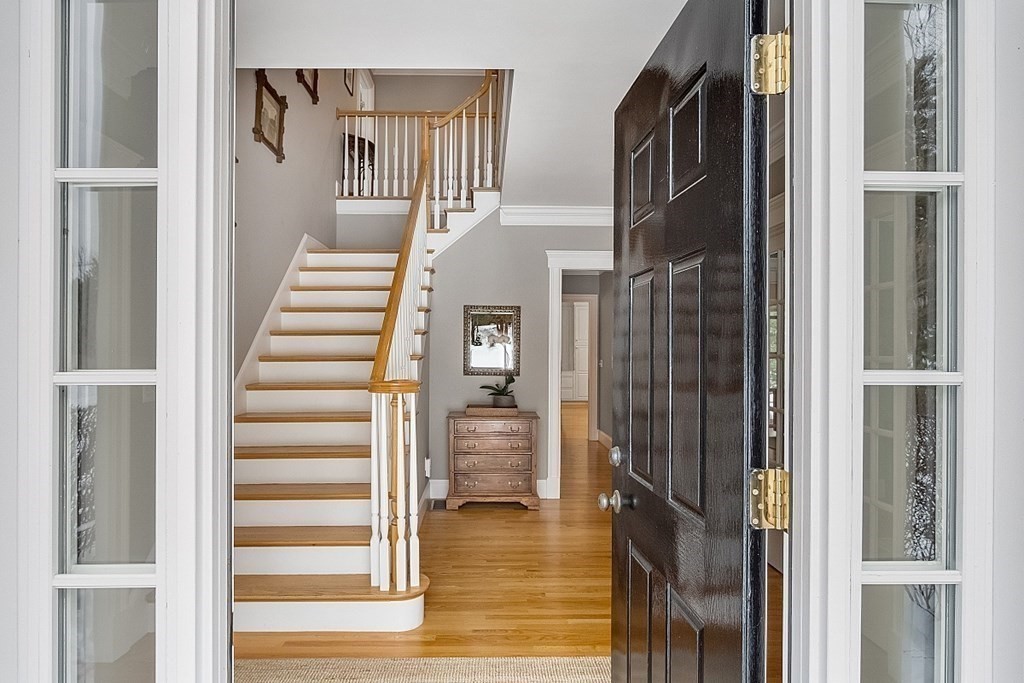 61 Garfield Road Concord, MA 01742 - Photo 28 of 33 a view of entryway and hall with wooden floor