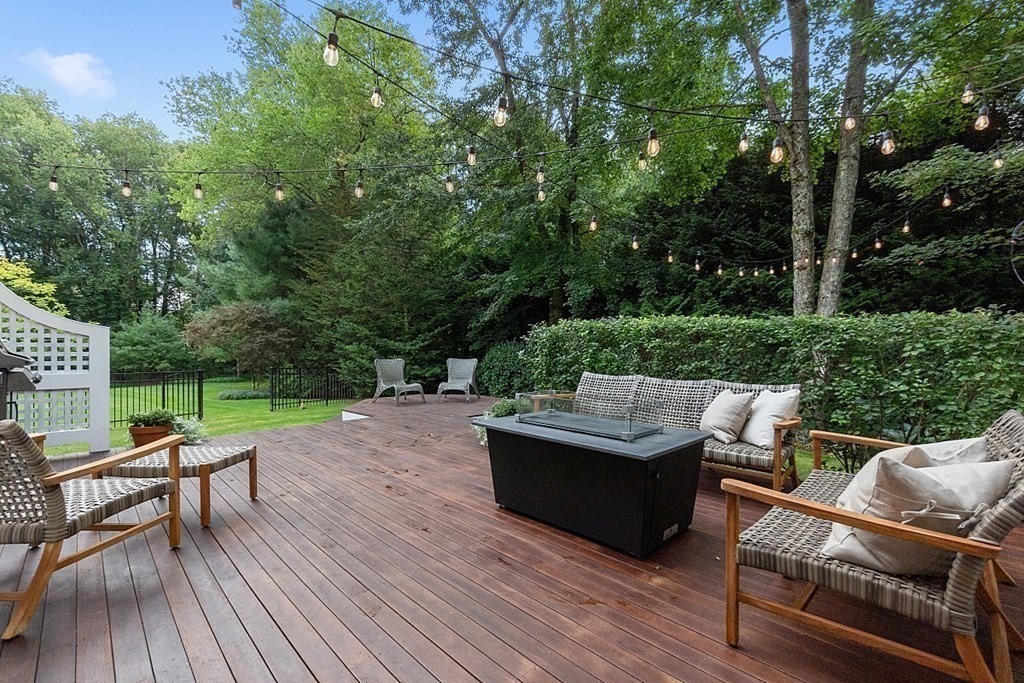 61 Garfield Road Concord, MA 01742 - Photo 30 of 33 a view of a patio with wooden floor and outdoor seating