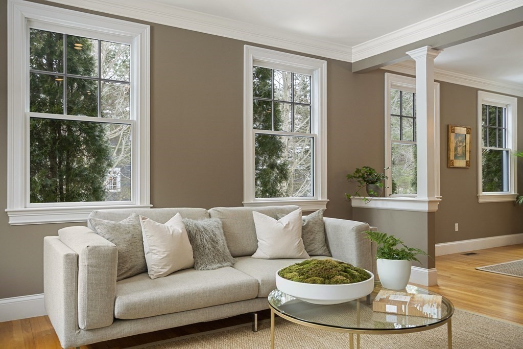 61 Garfield Road Concord, MA 01742 - Photo 4 of 33 a living room with a couches a table and a large window