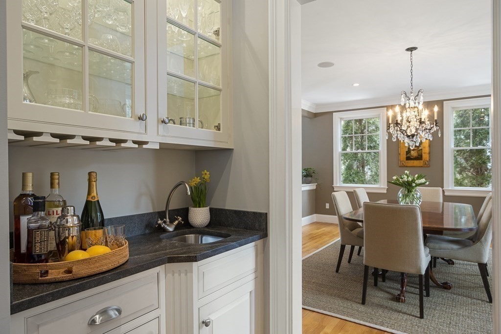 61 Garfield Road Concord, MA 01742 - Photo 7 of 33 a kitchen with a table chairs and cabinets