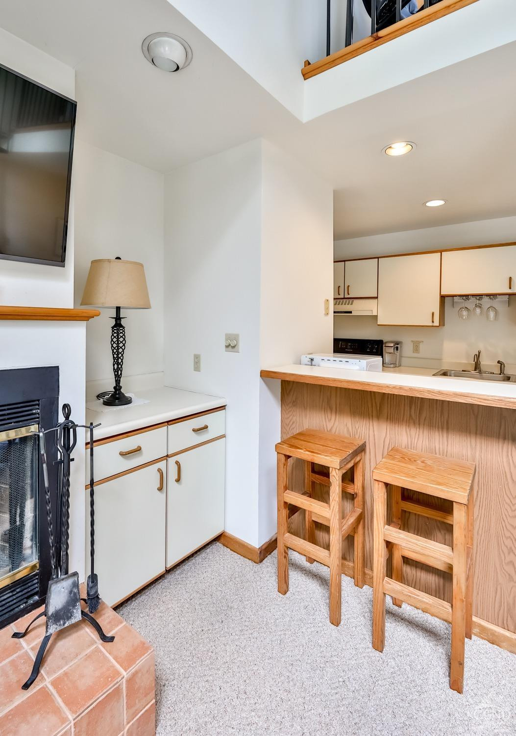 91 Windham Ridge Road, Unit 18B Windham, NY 12496 - Photo 17 of 30 a kitchen with a sink appliances and cabinets