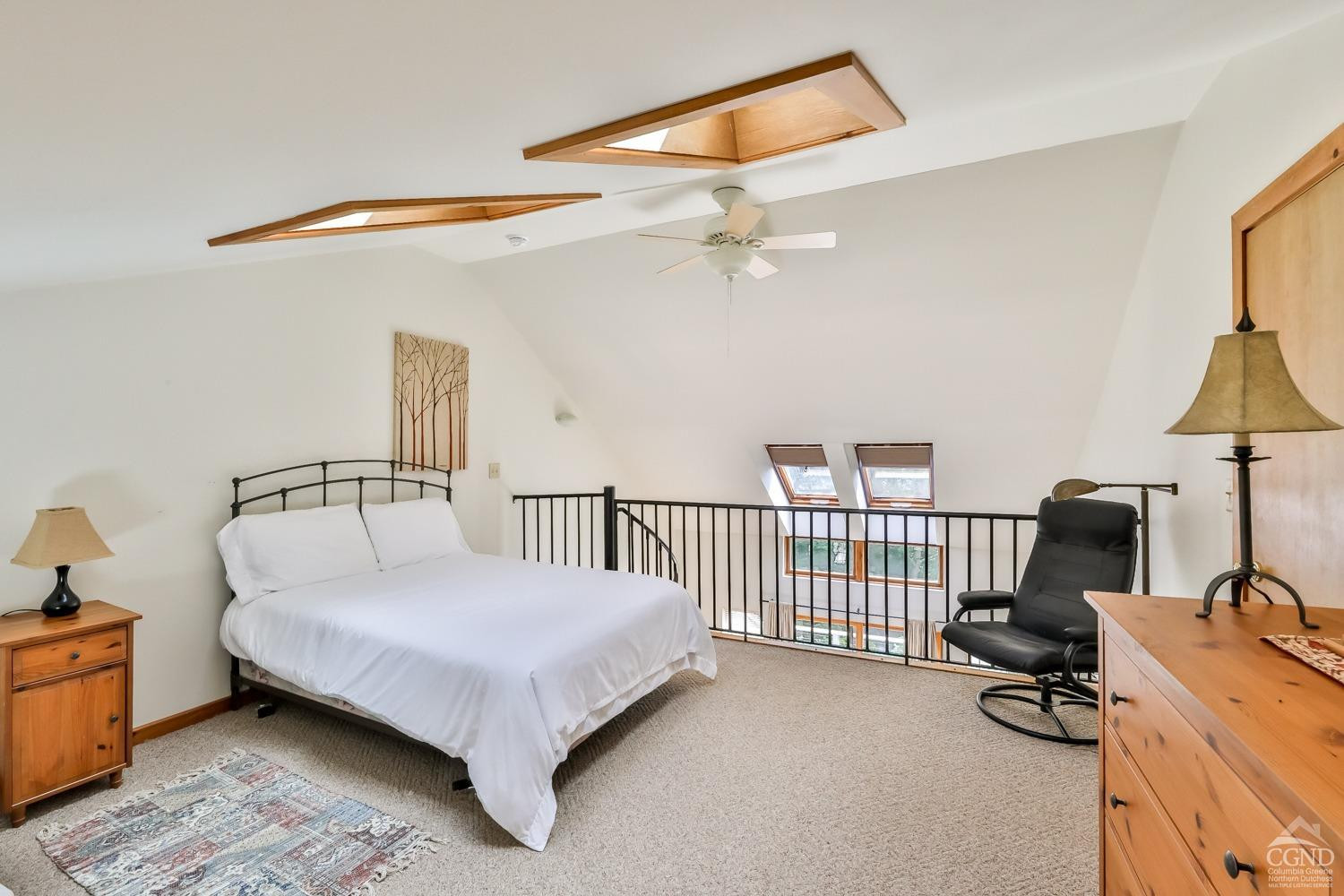 91 Windham Ridge Road, Unit 18B Windham, NY 12496 - Photo 20 of 30 a bedroom with a bed and a chandelier