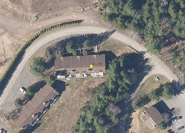 an aerial view of a house with outdoor space