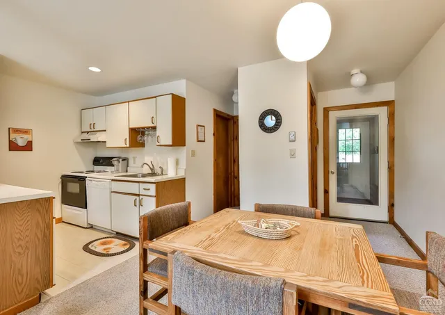 a kitchen with stainless steel appliances granite countertop a sink and cabinets