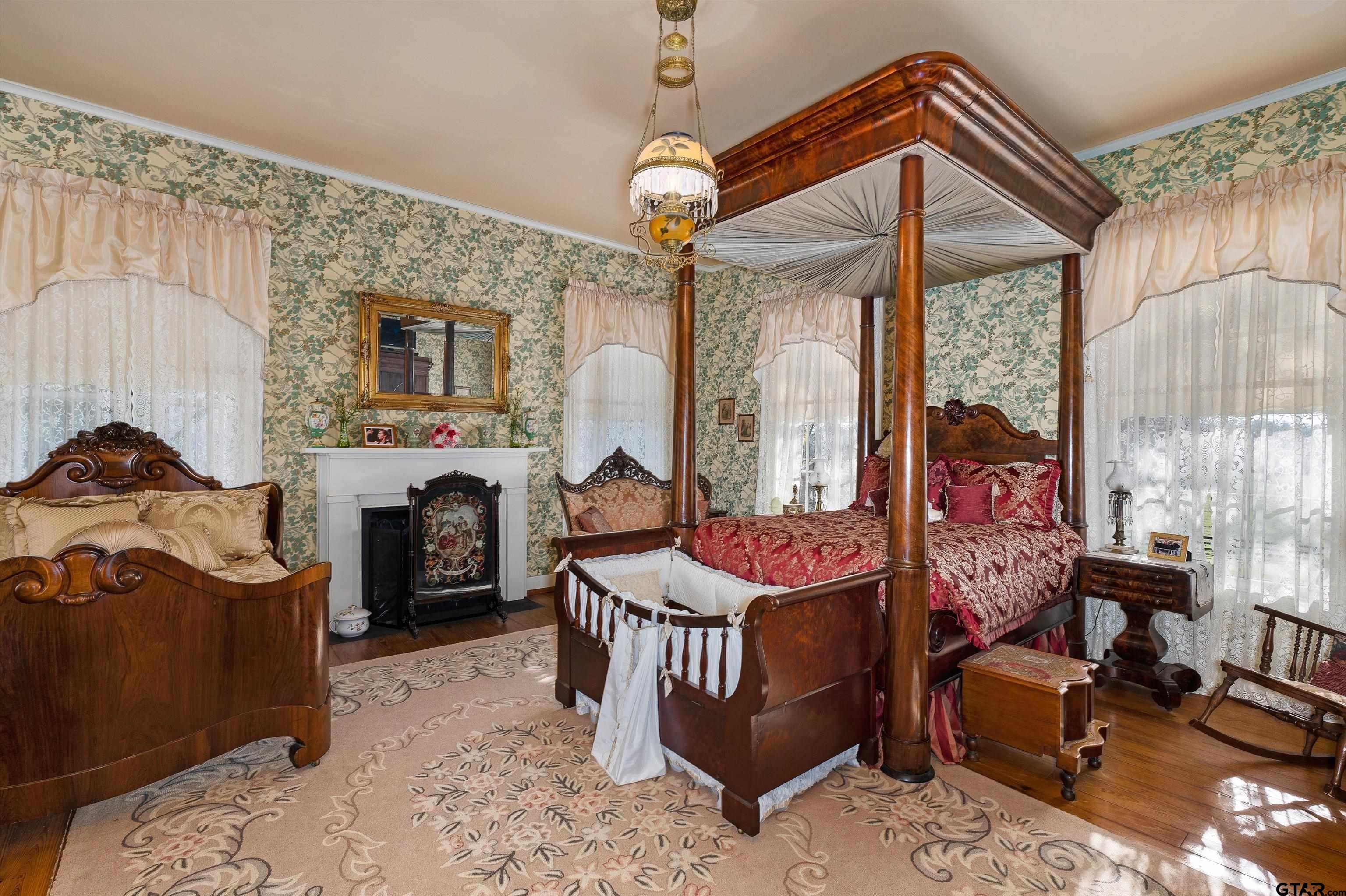 11992 County Road 4233 Cushing, TX 75760 - Photo 12 of 48 a living room with furniture a fireplace and a chandelier