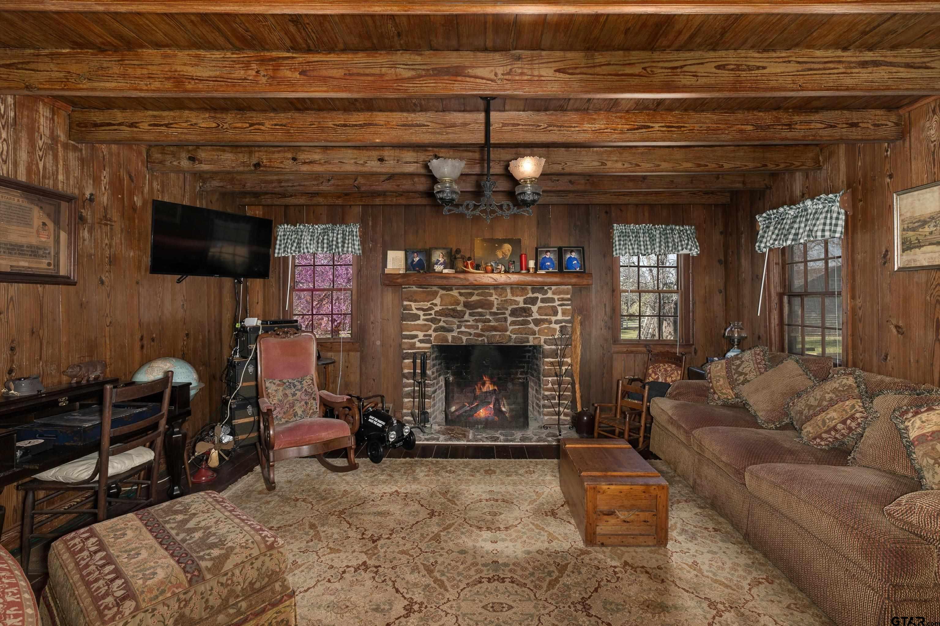11992 County Road 4233 Cushing, TX 75760 - Photo 21 of 48 a living room with furniture and a fireplace
