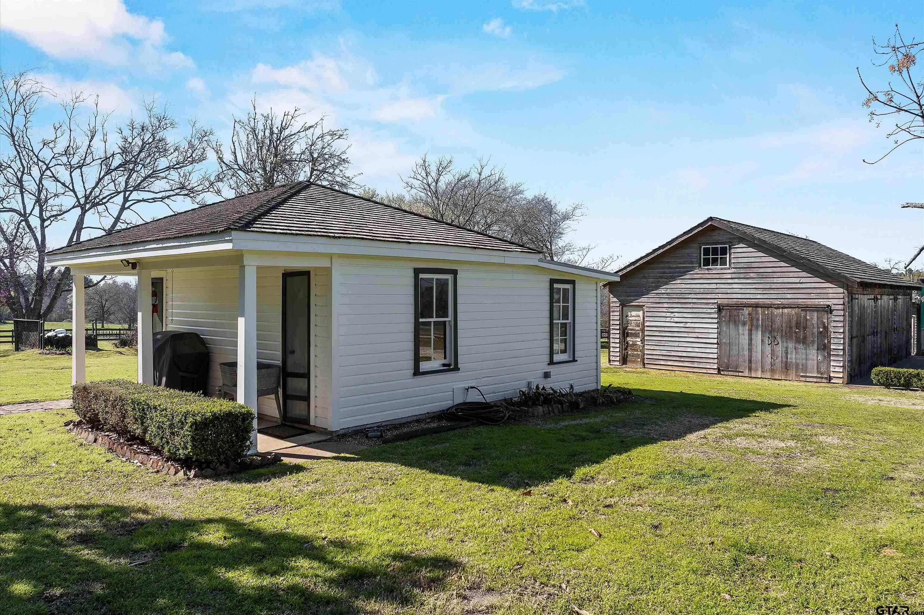 11992 County Road 4233 Cushing, TX 75760 - Photo 26 of 48 a front view of house with yard and green space