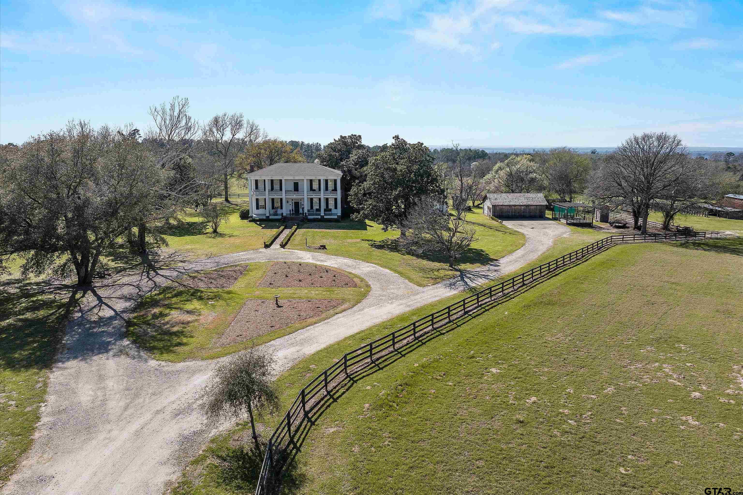 11992 County Road 4233 Cushing, TX 75760 - Photo 31 of 48 a view of a swimming pool with a yard and large trees