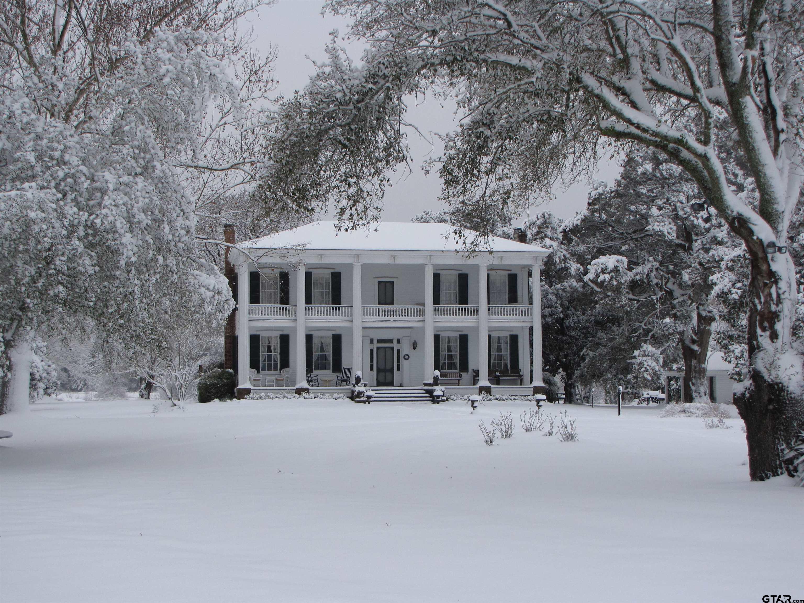 11992 County Road 4233 Cushing, TX 75760 - Photo 34 of 48 a tall building with trees in front of it